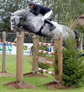 John Whitaker & Cassinis Chaplin Win Horse & Hound Senior Foxhunter Second Round at The Longines Royal International Horse Show